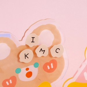 Cute cream-style acrylic cartoon bear standee with English letters in warm orange and pink