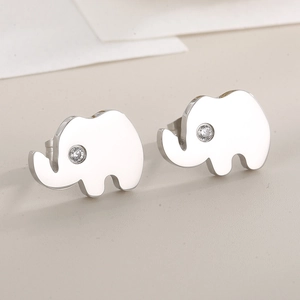 Macro detail of silver elephant stud earring in stainless steel with white zircon eye