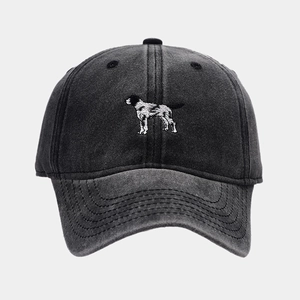 Close-up of retro washed cotton baseball cap featuring detailed dog embroidery and stitching