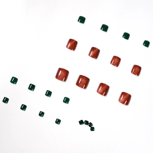 24-piece set of amber and jelly green press-on toe nails with a high-gloss finish