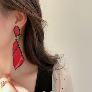 Retro red irregular acrylic geometric drop earrings with silver needle on a model