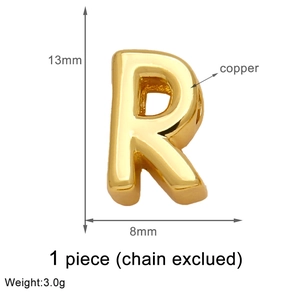 Detailed view of golden copper letter R pendant with 13mm height and 8mm width