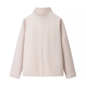 Macro detail of the back view of a light pink high neck sweater with drop shoulders