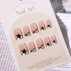 French style pearlescent press-on nails with silver edges and black star patterns
