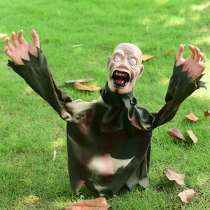 Scary Halloween groundbreaker zombie with glowing eyes and tattered clothes for yard decor