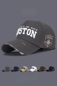 Detailed view of distressed baseball cap with 3D STON embroidery and logo patches