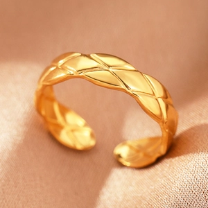 Bohemian gold stainless steel open ring featuring a quilted motif on silk fabric