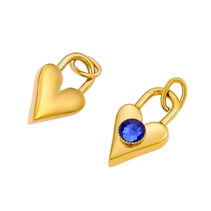 Close-up of golden heart pendants featuring a polished finish and blue zircon inlay