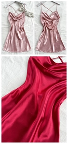 Detail view of cowl neck and crisscross back straps on satin mini slip dress