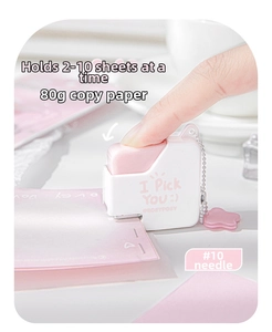 Mini pink stapler with star pendant showing 10 sheets binding capacity on desktop