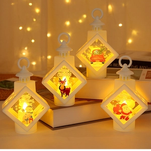 Cozy group setup of Christmas LED lanterns featuring snowman, elk and Santa designs