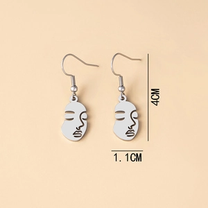Detailed view of abstract face earrings with size dimensions 4CM by 1.1CM in silver finish