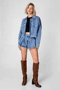 Close-up of light blue cropped denim jacket with matching belted high-waist shorts set