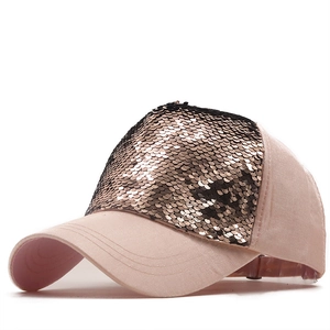 Pink velvet baseball cap with sparkling champagne gold sequins shown in a side view