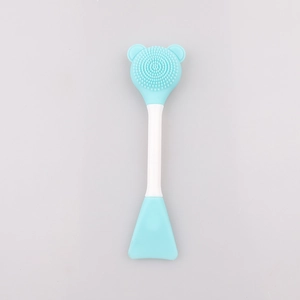 Detailed view of dual-ended silicone facial cleansing brush with bear ear design and soft scraper