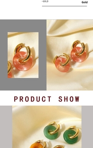 Detailed view of 18K gold plated hoop earrings with colorful natural stones on silk