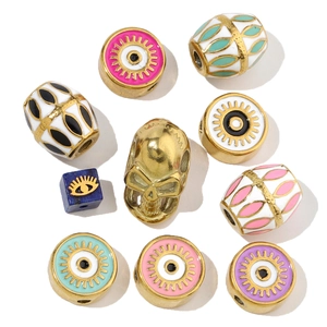 Detailed macro view of colorful evil eye enamel beads and skull metal jewelry charms