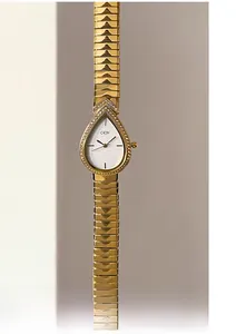 Close-up of golden teardrop watch face with sparkling crystal bezel on metal strap