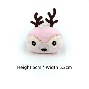 Detail view of 6cm plush reindeer cartoon pin with embroidered face and size markings
