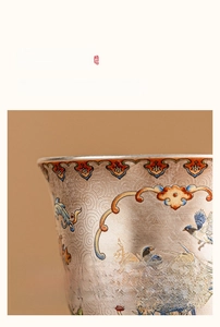 Detail of silver enamel tea cup showing traditional floral patterns and smooth rim