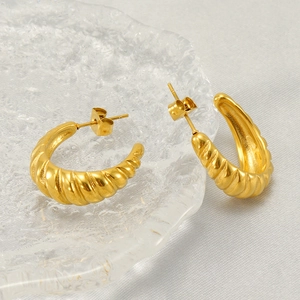 Golden spiral geometric hoop earrings in a minimalist stainless steel circular design