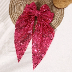 Sparkly peach pink sequin oversized bow hair clip with long streamers for women