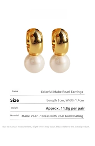 Macro detail of Mabe pearl gold earrings showing 3cm x 1.4cm dimensions and brass material