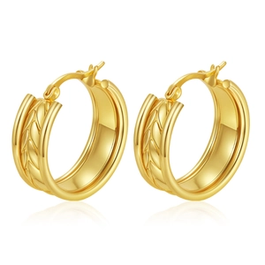 Macro detail of gold hoop earrings featuring intricate woven texture and high-shine finish