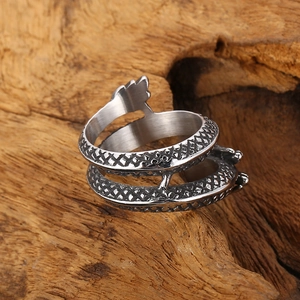 Macro detail of retro stainless steel ring featuring intricate dragon scale textures