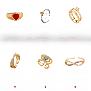 Detail showing various copper rings with stones, pearls, and bee designs on white background