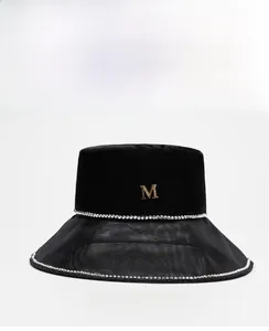 Detail of black velvet bucket hat featuring sparkling rhinestones and sheer mesh brim