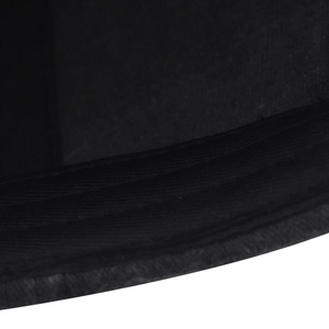 Close-up detail of reinforced stitching on black washed cotton baseball cap brim