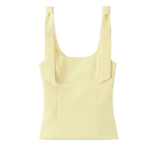 Pale yellow square neck tank top with elegant bow shoulder straps on white background
