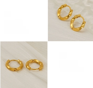 Detail of gold twisted hoop earrings with polished 18K plating and spring clasp