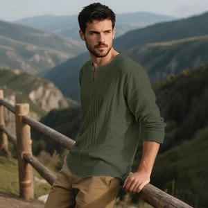 Men's dark green cotton linen Henley shirt with long sleeves in a relaxed outdoor setting