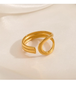 Detailed close-up of 18K gold-plated adjustable ring with matte finish on white silk