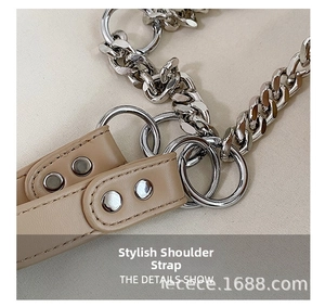 Detail of the chic beige PU leather strap with silver alloy chain and metal ring accents