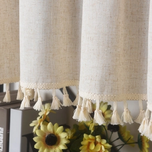 Nordic minimalist linen curtain with tassel fringe edges in a warm beige texture