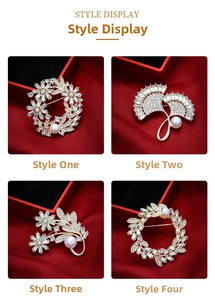 Detailed close-up of four luxury gold brooches with white pearls and sparkling zircons