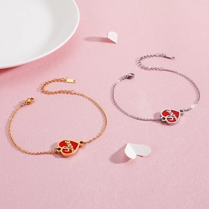 Adjustable stainless steel heart bracelet with red Love charms in gold and silver