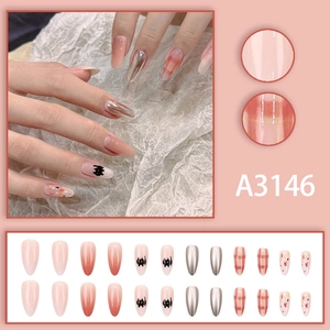 Almond-shaped press-on nails featuring cute black cat patterns and orange plaid designs
