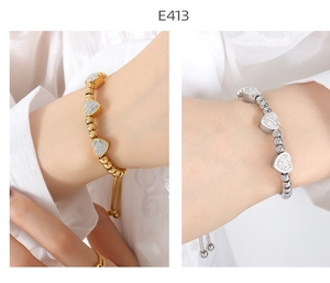 Detail of beaded gold and silver heart bracelets with sparkling pavé crystals and adjustable slide