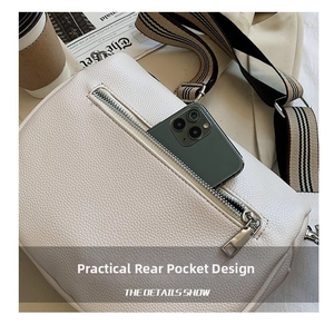 Detailed back view of white lychee leather crossbody bag with functional zip pocket