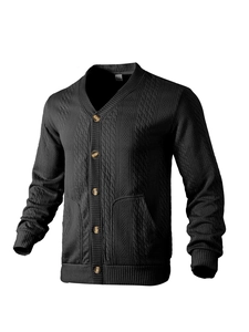 Detail of the black knit cardigan showing cable knit texture and wooden buttons