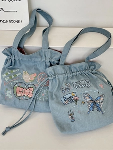 Denim tote bag with butterfly embroidery, drawstring closure and checkered lining
