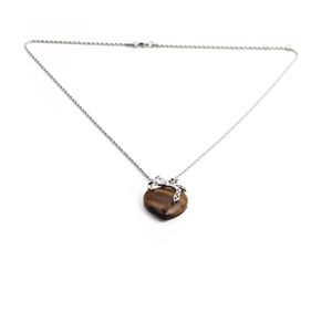 Tiger eye stone heart pendant necklace with silver bow detail on minimalist metal chain