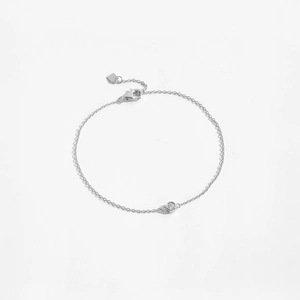 Macro shot of 925 sterling silver bracelet showing lobster clasp and single cubic zirconia
