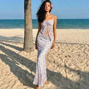 Detailed view of white floral two-piece mesh set with camisole top and matching long skirt