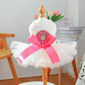 Detail of pet princess tutu dress with pink satin bow and donut sequin embroidery