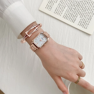 Elegant rose gold square watch and rhinestone bracelet set for women on white background